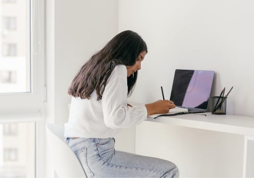 Woman seated and focused on studying